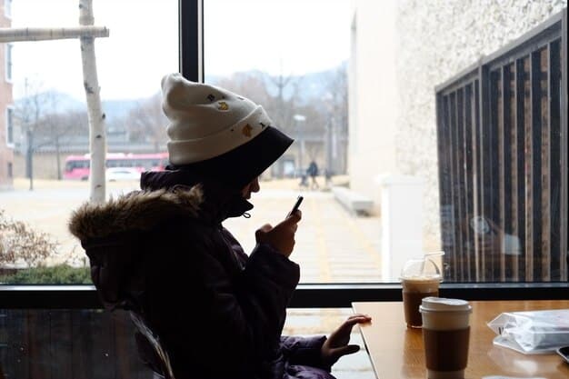 A person using the Saga phone at a coffee shop in a bustling US city, showcasing the ease and convenience of accessing Web3 applications on the go.
