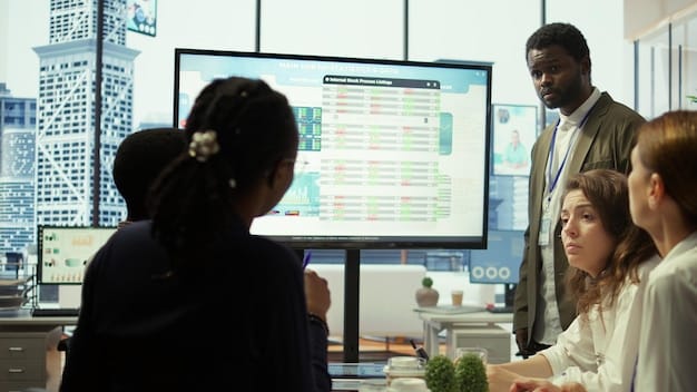 A diverse team of professionals collaborating in a modern office, reviewing project milestones and discussing strategic plans on a large display screen.